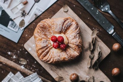sweet-vanilla-pastry-with-raspberries-on-top.jpg